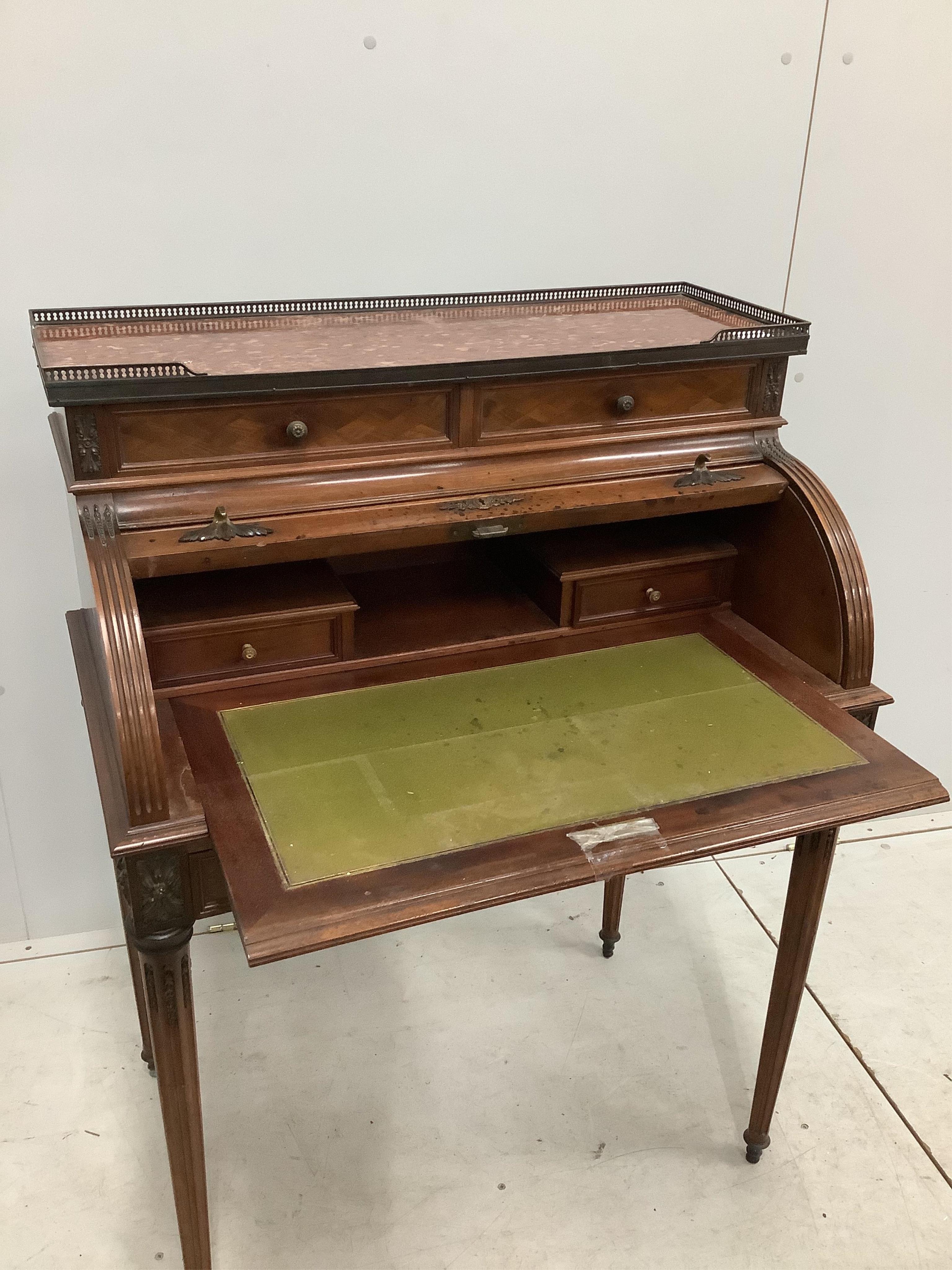 A late 19th / early 20th century French parquetry inlaid, gilt metal mounted, rouge marble topped mahogany cylinder bureau, width 79cm, depth 50cm, height 107cm. Condition - good but lacking key